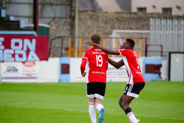 Mallon celebrates his stoppage time insurance goal against Drogheda United on Saturday with Ibrahim Meite.