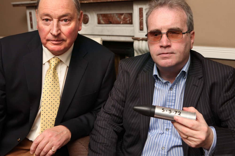 Charles Inness and Richard Moore (holding the rubber bullet that blinded him in 1972).