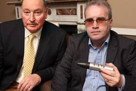 Charles Inness and Richard Moore (holding the rubber bullet that blinded him in 1972).