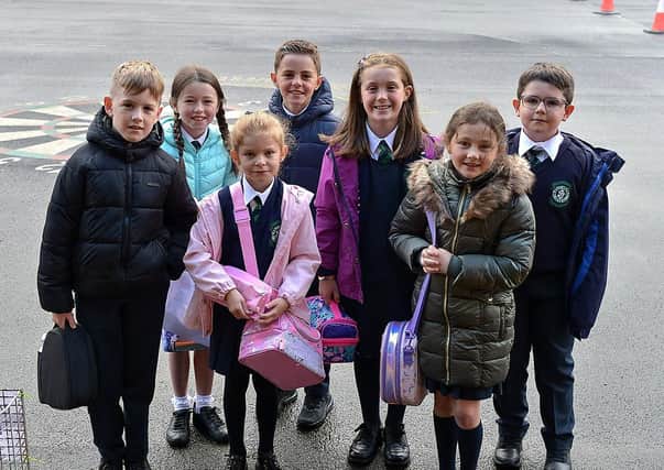 Pupils from P5 arrive for classes at St. Patrick’s Primary School, Pennyburn, yesterday morning. (Photo: George Sweeney) DER2036GS - 007