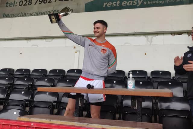 Lavey captain Eamon McGill lifts the trophy following the victory over Banagher in Celtic Park.