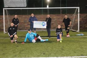 Mayor Brian Tierney with players and representatives of Street Soccer NI.