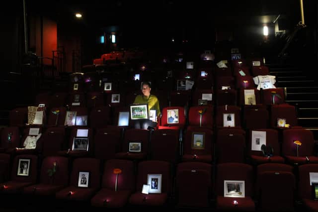 The theatre is being filled with objects and images sent in from people who have lost loved ones.