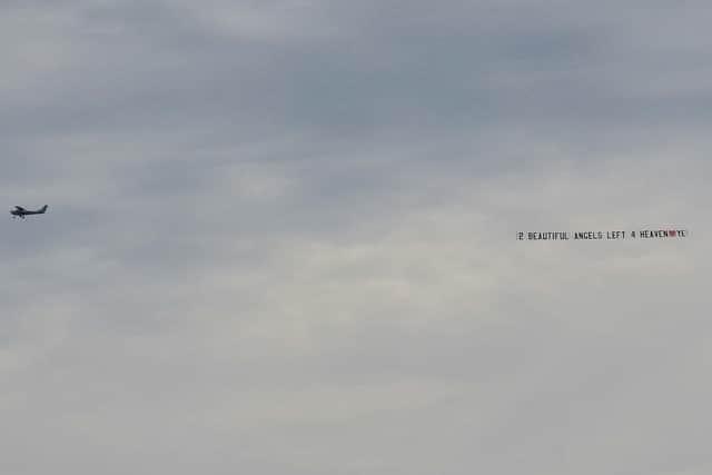 An aeroplane displays a banner reading ‘2 Beautiful Angels Left 4 Heaven’ at the funeral of three-year-old Kelsey Marie Stokes yesterday morning.  Kelsey died in a tragic road accident along with Shauna Stokes (17) in Horden, County Durham on Wednesday, September 2nd.  DER2038GS – 0031