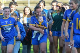 Steelstown’ s Emma Doherty celebrates with her four month old daughter, Cara, after winning the Derry Ladies Senior Football Championship Final in Celtic Park on Sunday. (DER2038GS)