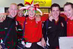Derry City players arrive at George Best Belfast City Airport fresh from the five goal defeat of Gretna. Two goal hero Kevin Deery wears the jesters hat given to him by a fan following the game.