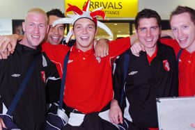 Derry City players arrive at George Best Belfast City Airport fresh from the five goal defeat of Gretna. Two goal hero Kevin Deery wears the jesters hat given to him by a fan following the game.