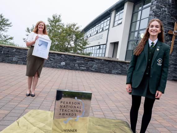 Mrs Martine Mulhern, Principal and Jeannie McLaughlin, Head Girl, pictured receiving the Silver Award for Secondary School of the Year. Shortlisted from schools across the UK and now entered for the Gold Award final next month.