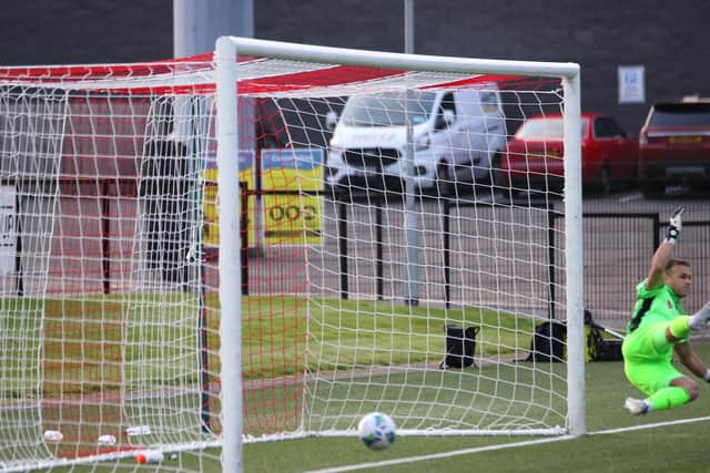 Waterford keeper, Brian Murphy is sent the wrong way by Conor Clifford's spotkick. Picture by Kevin Moore.