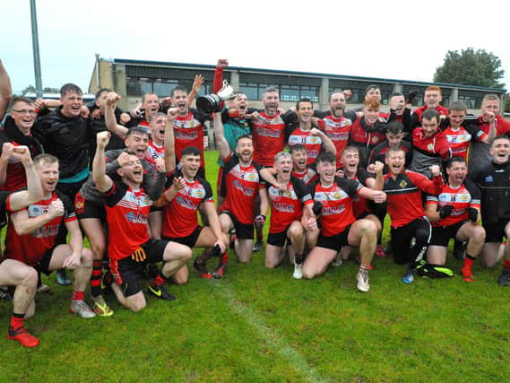 Greenlough celebrate winning the IFC Final against Steelstown, at Bellaghy on Sunday afternoon last. (DER2041GS – 014)