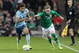 Ireland's Ronan Curtis gets away from Northern Ireland's Jamal Lewis.