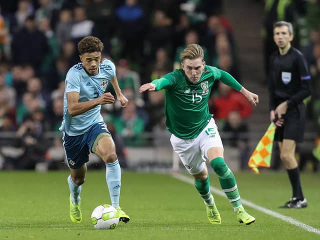 Ireland's Ronan Curtis gets away from Northern Ireland's Jamal Lewis.