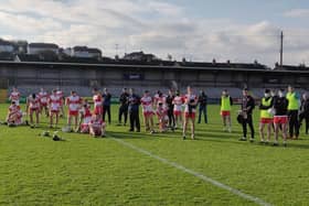 Disappointed Derry players following their defeat to Down in the League 2B final in the Athletic Grounds