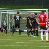 Dundalk players celebrate after Sean Murray gives the visitors an 8th minute lead at Brandywell. Photograph by Kevin Moore.