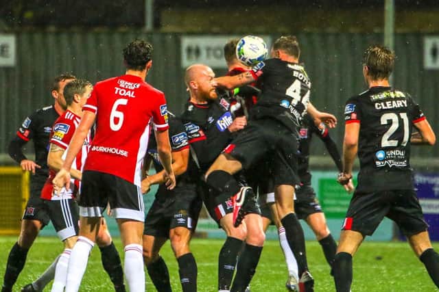 The ball comes off the arm of Dundalk defender Andy Boyle late in the game but referee Rob Harvey waved play on. Photograph by Kevin Moore.