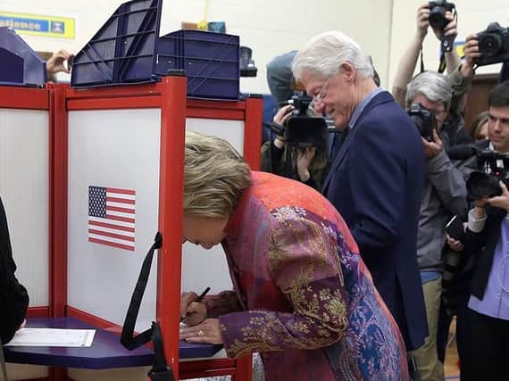 Hillary and Bill Clinton voting at a Pakflatt booth in 2016.