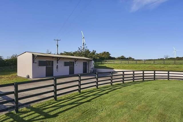 External features include two stables and tack room