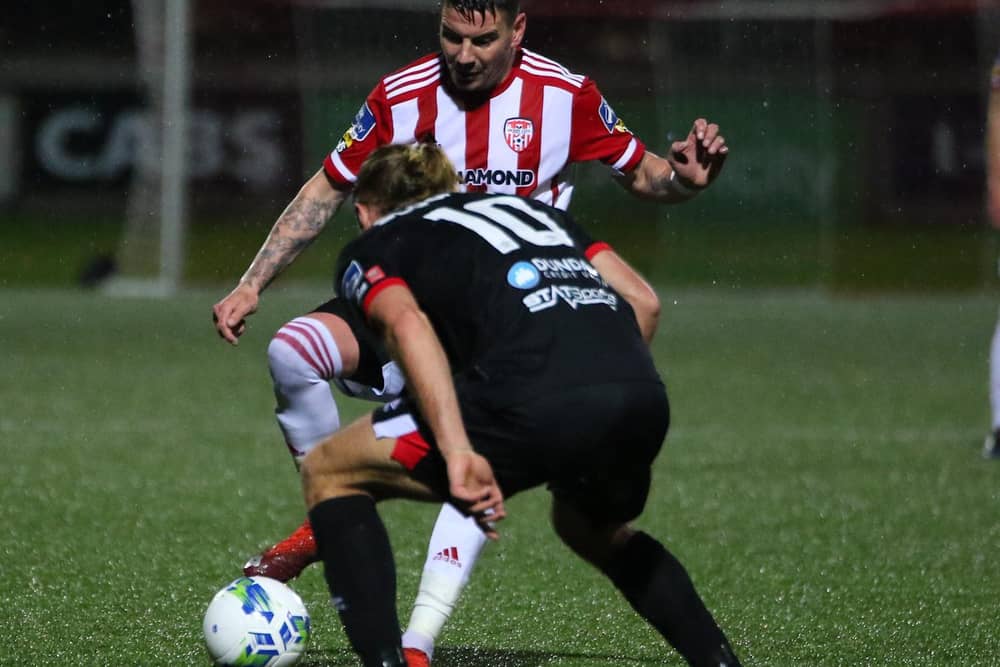 Derry City wideman, Adam Hammill pictured in action against Dundalk's Greg Sloggett on Monday night at Brandywell. Picture by Kevin Moore.
