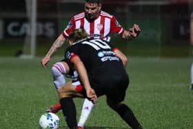 Derry City wideman, Adam Hammill pictured in action against Dundalk's Greg Sloggett on Monday night at Brandywell. Picture by Kevin Moore.