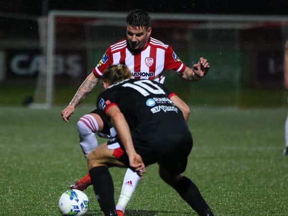 Derry City wideman, Adam Hammill pictured in action against Dundalk's Greg Sloggett on Monday night at Brandywell. Picture by Kevin Moore.