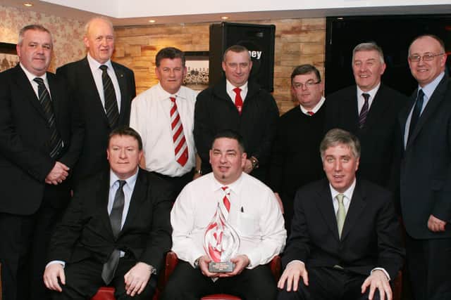 Charlie (back row, third from right) and some of the team who were crowned 'Match Day Management Team of the Year 2010' plus other club officials. At front, seated are, Philip O'Doherty, Derry City FC chairman, and John Delaney, chief executive, FAI. At back