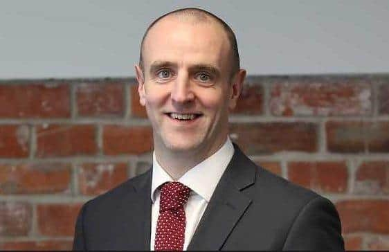 Mark H Durkan.