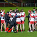 Rory Gallagher gives some words of encouragement to his Derry players during the second half water break on Sunday in Celtic Park.