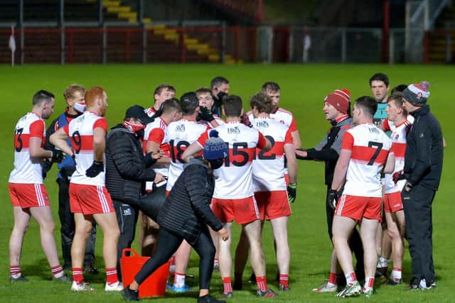 Rory Gallagher gives some words of encouragement to his Derry players during the second half water break on Sunday in Celtic Park.