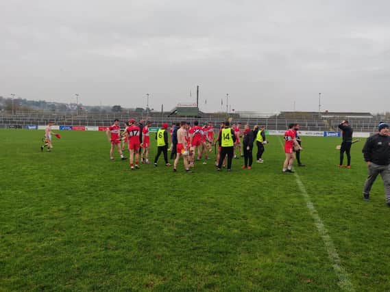 Derry players after the final whistle in Newry on Saturday.
