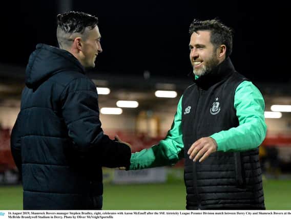 Aaron McEneff and Stephen Bradley embrace after Shamrock Rovers victory over Derry City at Brandywell.