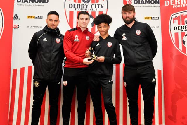 Derry City youngster, Trent Doherty, pictured with coaches, Neil McCafferty and Paddy McCourt and first team left-back, Ciaran Coll.