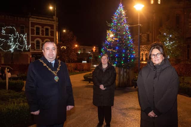 Councillor Brian Tierney, Mayor of Derry City and Strabane District Council has presented a tree of Remembrance to Francine Moran and Jennifer McCollum, from Brighter Days at the Peace Garden in Foyle Street. Picture Martin McKeown. 24.11.20