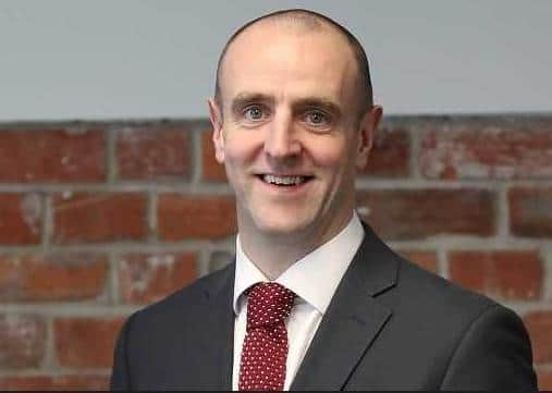 Mark H Durkan.