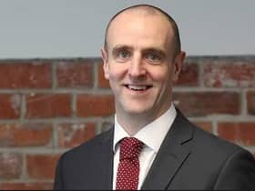 Mark H Durkan.