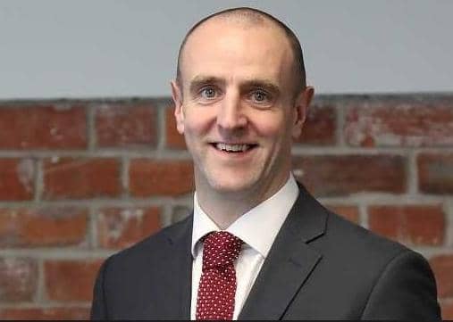 Mark H Durkan.