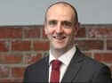 Mark H Durkan.