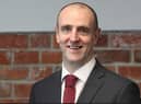 Mark H Durkan.