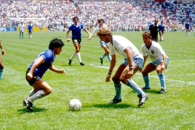 Diego Maradona glides past the England defence at the 1986 World Cup.