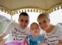 Hollie with her dad Ciaran and mum Laura on a carriage ride to her belated sixth birthday party. Hollie spent her actual birthday in hospital.
