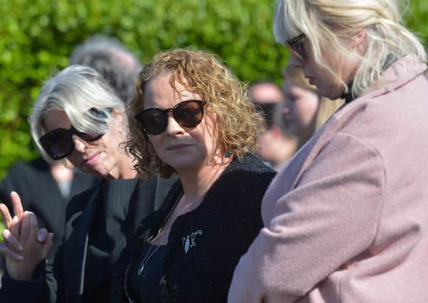 Geraldine Mullan pictured at the funeral of her husband, son and daughter in August 2020.