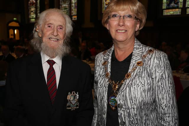Veteran diver Ray Cossum pictured with the then Mayor Hilary McClintock at an event to mark the centenary of the sinking of the Laurentic.