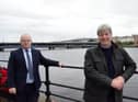 Translink's John Glass and Joe Mahon with the Craigavon Bridge in the background.