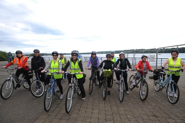 Group from the Derry Well Woman pictured on a cycle across Derry's Peace Bridge for Bike Week a number of years ago.