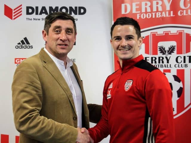 Derry City boss, Declan Devine and defender, Ciaran Coll after the St Johnston man signed a new two year deal.