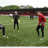 Peter Cherrie warms up with Nathan Gartside and Jack Lemoignan.