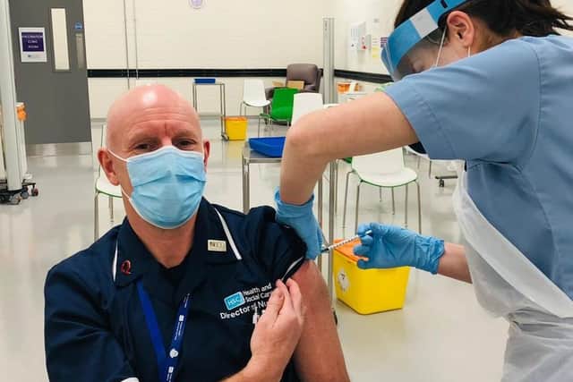 Dr Bob Brown, the Trust’s Director of Primary Care and Older peoples services, receiving the vaccination on Tuesday morning.