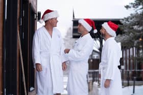 Gordon, Gino and Fred walk through the snow in  dressing gowns as they head for a sauna