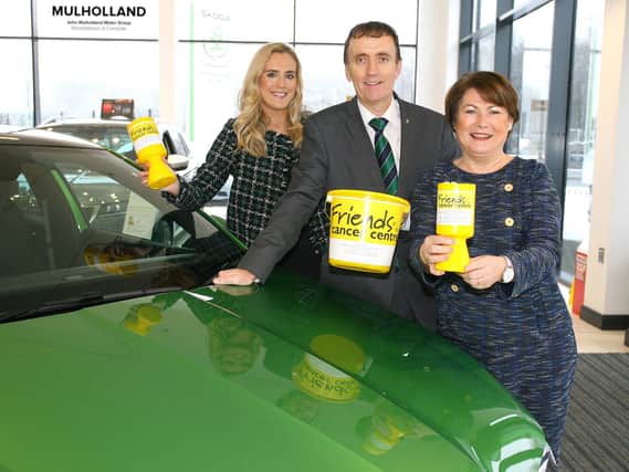 John Mulholland, owner of John Mulholland Motors, is pictured with his daughter, Shona Mulholland (left) and Colleen Shaw (right), chief executive of Friends of the Cancer Centre, at the launch of a new partnership with the local charity.  The award winning car dealership in Randalstown and Campsie is pledging to donate £40,000 in addition to other fundraising activity to help Friends of the Cancer Centre fund vital nursing hours, which supports thousands of local people every year.  The family owned company has a very personal reason for supporting Friends of the Cancer Centre, as owner John Mulholland was diagnosed with kidney cancer in June 2018.  John has benefitted from Friends of the Cancer Centre’s work first hand, particularly through the support of his clinical nurse specialist, who is funded by the charity.