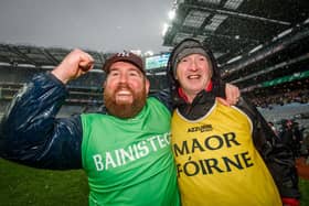 Dominic McKinley (right) enjoying All Ireland success with Slaughtneil manager Damien McEldowney in 2019.