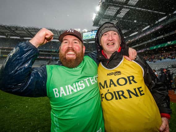 Dominic McKinley (right) enjoying All Ireland success with Slaughtneil manager Damien McEldowney in 2019.